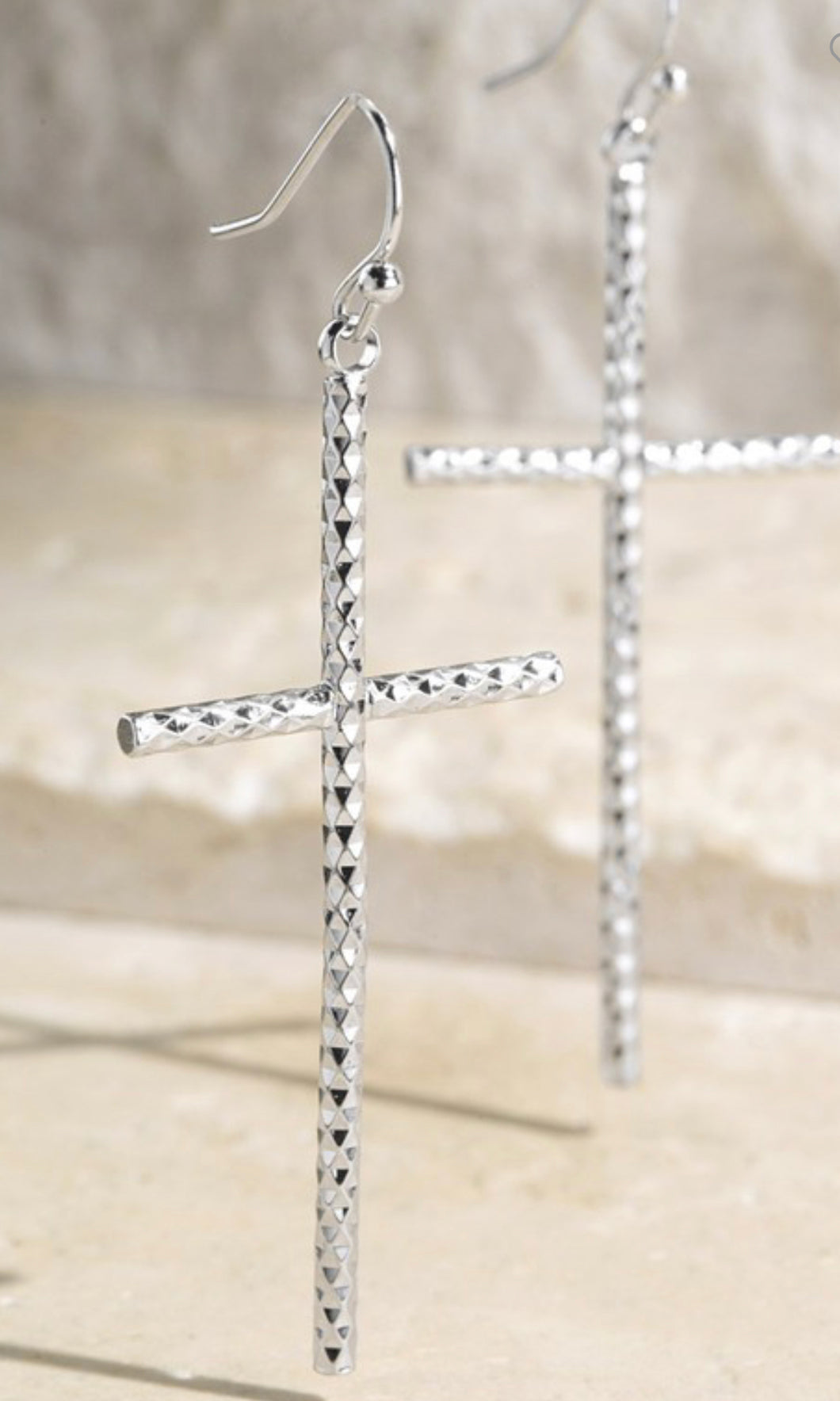 Textured cross dangling cross